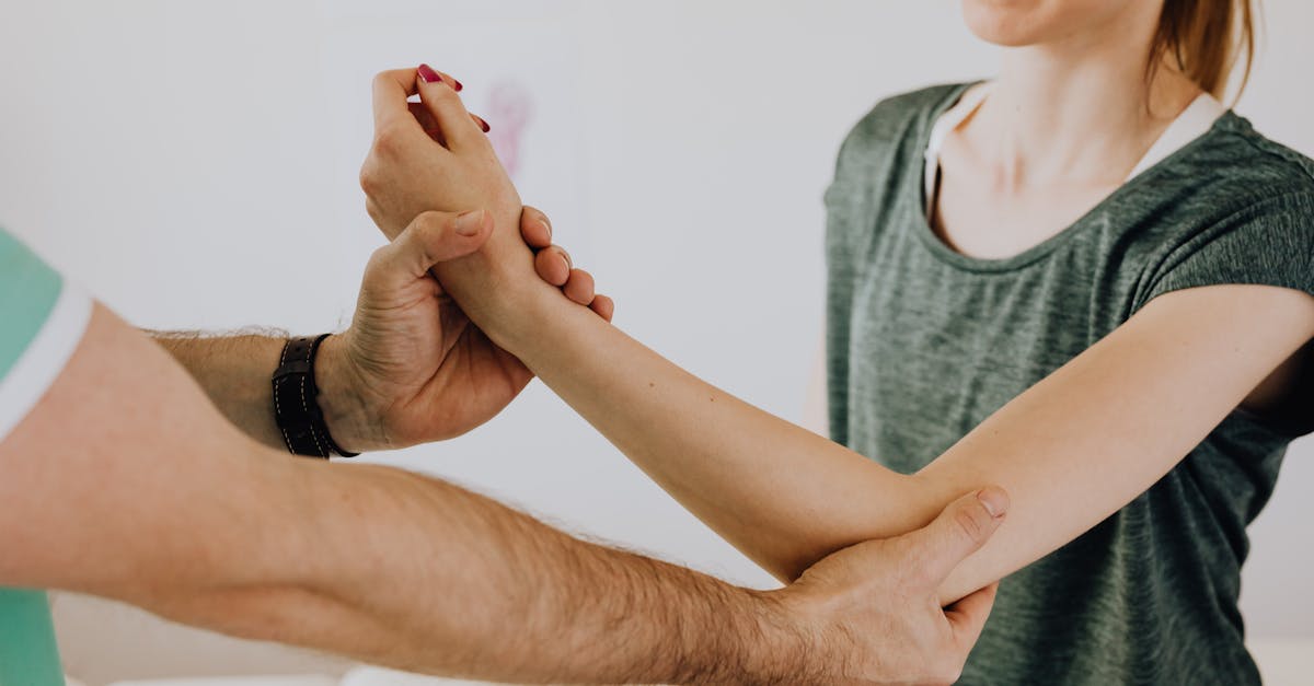 image of a physiotherapy session focusing on arm movement and manual adjustment